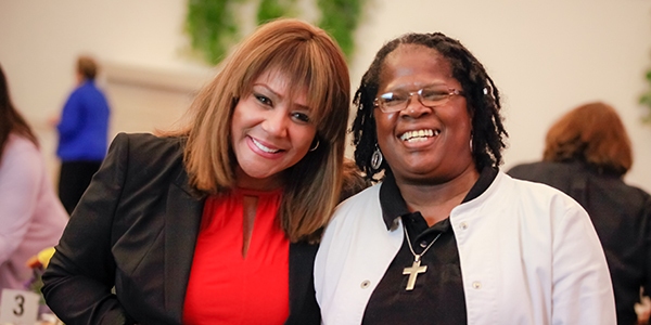 Debra, right, with Carole Meekins at St. Catherine’s 125th Anniversary celebration.