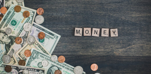 Picture of currency and the word money spelled out in scrabble letters