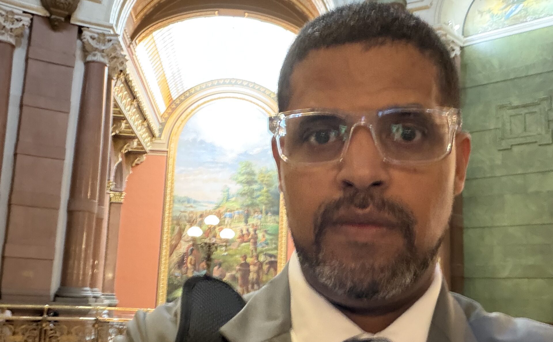 Mercy Housing Lakefront’s Edgar Flagg III, Vice President of Real Estate Development stands in Capitol rotunda