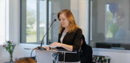 Cerise speaking at a podium